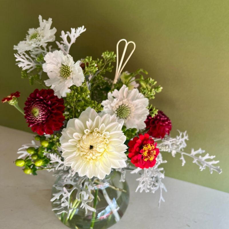 Funeral flowers in red and white for a Wisconsin Badgers fan